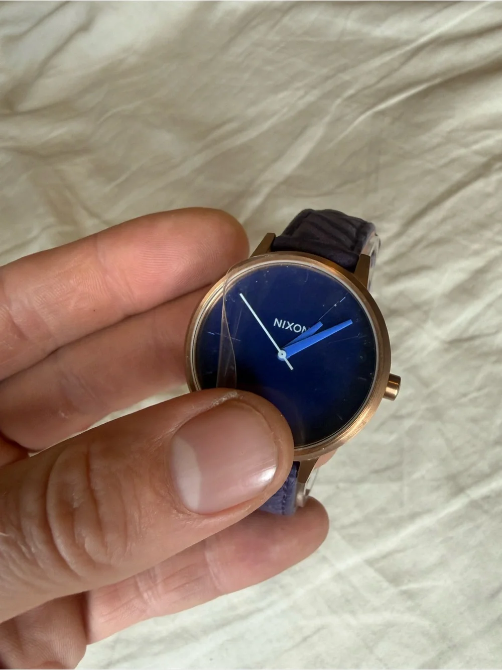 Nixon women’s purple Dial Leather Strap Watch